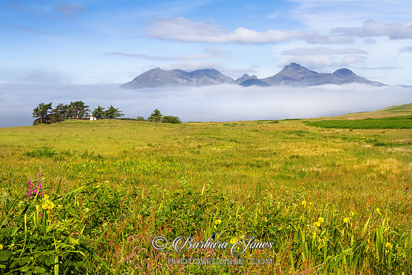 Cleadale. View of Rum. Morning Haar Clearing. Isle of Eigg. Scotland..