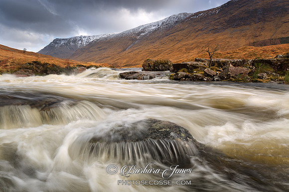 Glen Etive River in Spate Alltchaorunn Highland Scotland.
