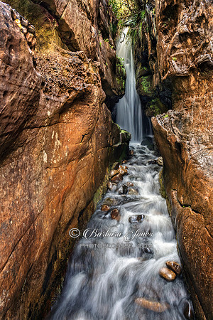 Singing Sands. Waterfall Isle of Eigg Scotland.
