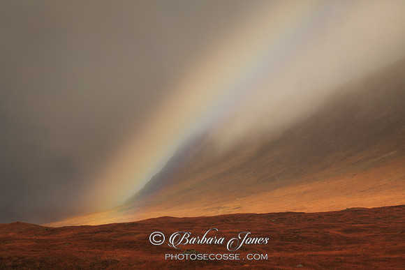 Rainbow and Mist. Glen Coe Gloom. Scotland.