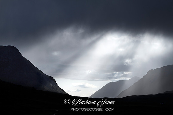 Sunbeams. Glen Coe. Silhouette.  Scotland.