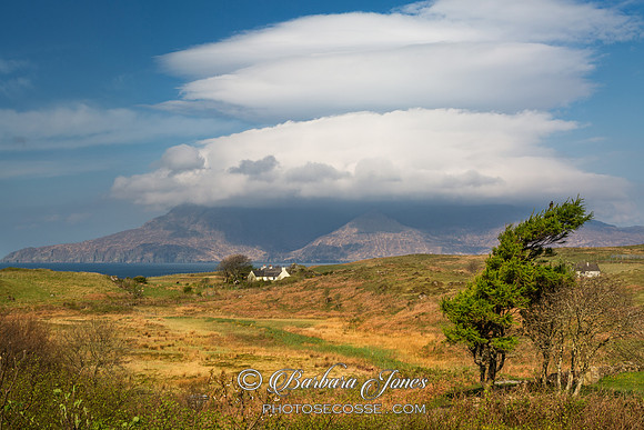 Lenticular clouds over Rum. Cleadale.  Isle of  Eigg. Scotland.