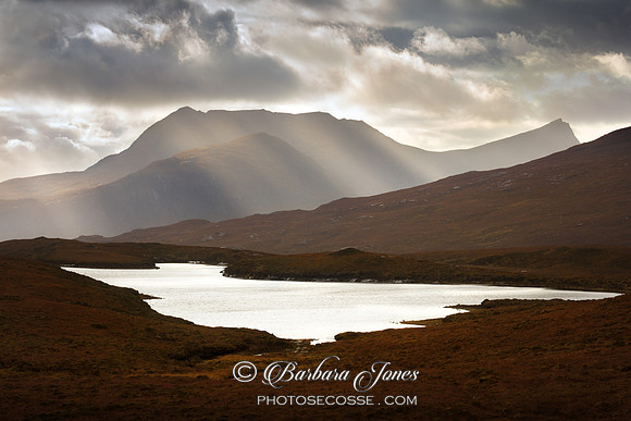 Ben Mor Coigach Sunbeams NW Geopark Scotland.
