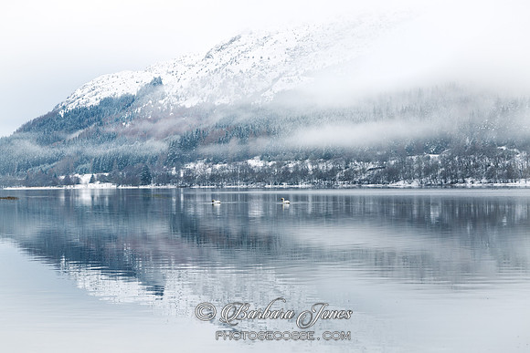 Loch Lubnaig. Mist and snow reflection. Trossachs National Park. Scotland.