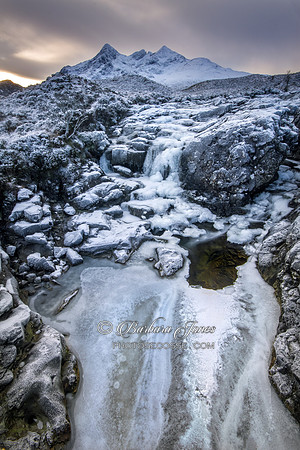 Sgurr Nan Gillean and frozen waterfall. Isle of Skye, Scotland.