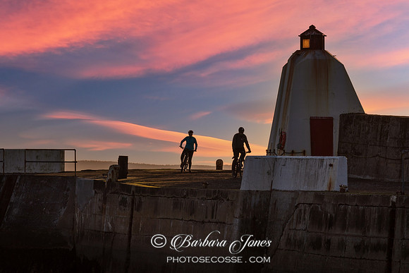 Burghead Breakwater Sunset Bikers Moray Scotland.