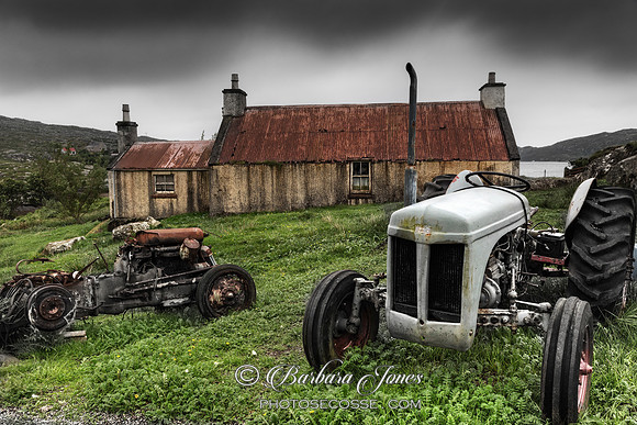 Golden Road . Tractor and Abandoned Home. Isle of Harris. Scotland.